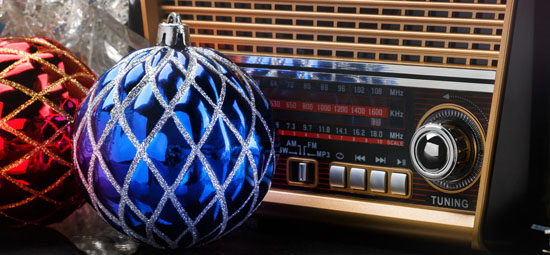 radio receiver in retro style with blue and red holiday decorations 