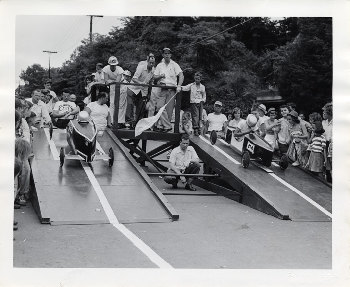 black and white photo of box cart race