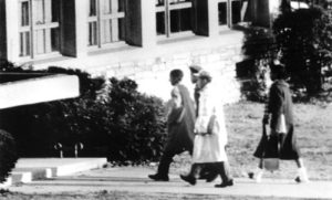 black and white photograph of 4 black students entering Stratford Junior High in 1959