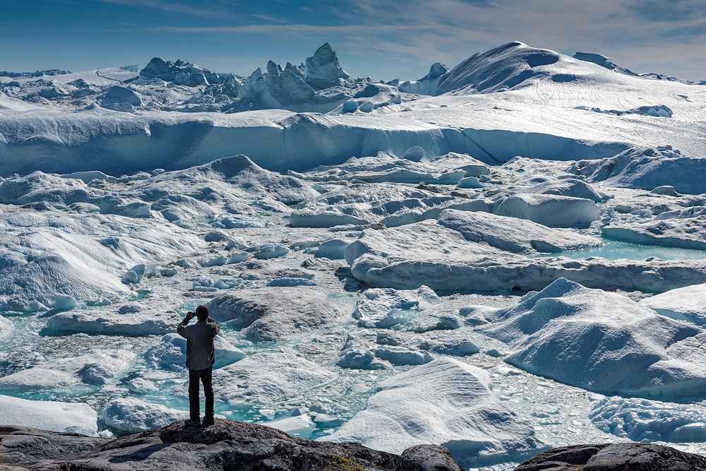 Photo of a man standing on a glacier