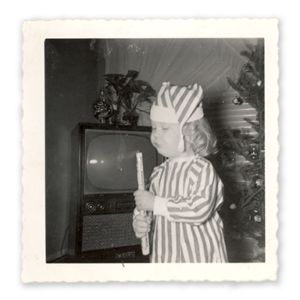black and white photo of Library Director Diane Kresh as a small child at Christmas