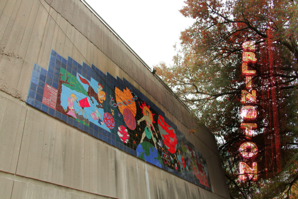Photo of the Columbia Pike Branch Library mosaic and the Arlington Drafthouse sign by Herlinda Hernandez