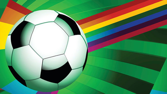 Soccer ball on green and rainbow background