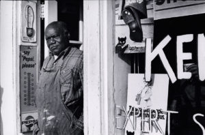 Photo of Richard Walker standing in a shop doorway