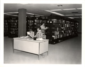 Central Library Reference Desk, early 1960s, librarian on phone