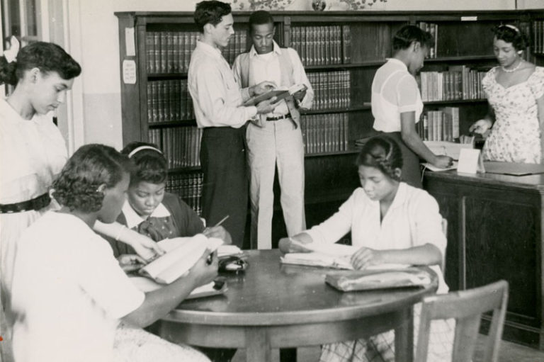 African American students reading in the library