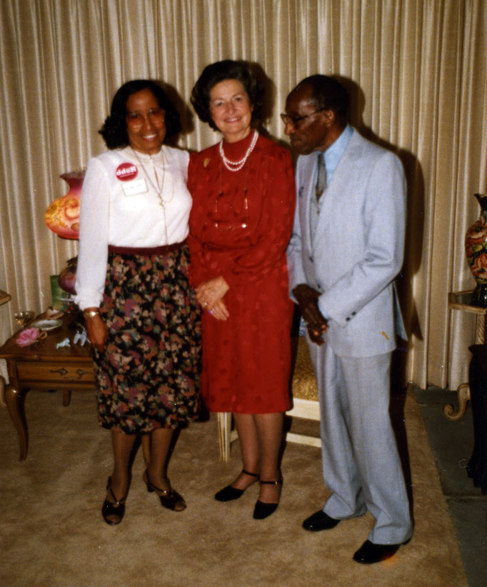 Edmund Fleet and an unknown woman flank Lady Bird Johnson at a Chuck Robb campaign event held at Fleet's house