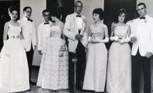 Prom Bishop O'Connell 1964 a row of young women in white dresses and young men in white jackets
