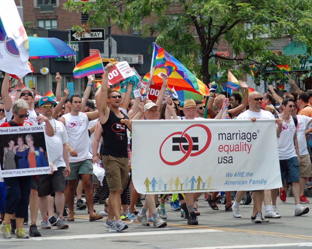 People marching with signs for marriage equality