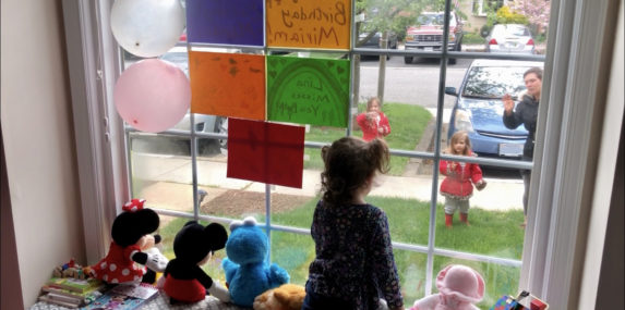 My toddler daughter wishing her neighborhood friend a happy 5th birthday during social distancing. Like other neighbors who wanted to help the birthday girl celebrate, we made a Happy Birthday sign and some drawings and taped them to our window for her to see.