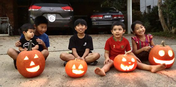 Sharing a love of books and storytelling to playing outdoor hide and seek, the Feliciano brothers and Kan kids live across the street from each other and have become the closest of friends this year. We had a blast carving pumpkins together on our driveway - a first time for most of the kids! Pumpkin seeds were saved to roast and snack on and the pumpkins will be composted after Halloween in the bountiful Kan garden. Happy kids carved happy pumpkins!