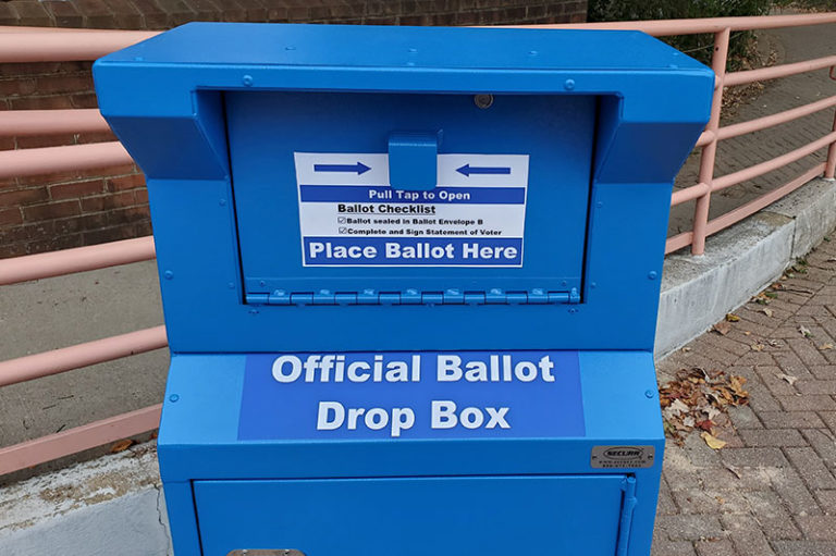 Official Ballot Drop Box is blue and has a door like a mailbox.