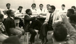 George Richardson talking with several younger Hoffman-Boston students.