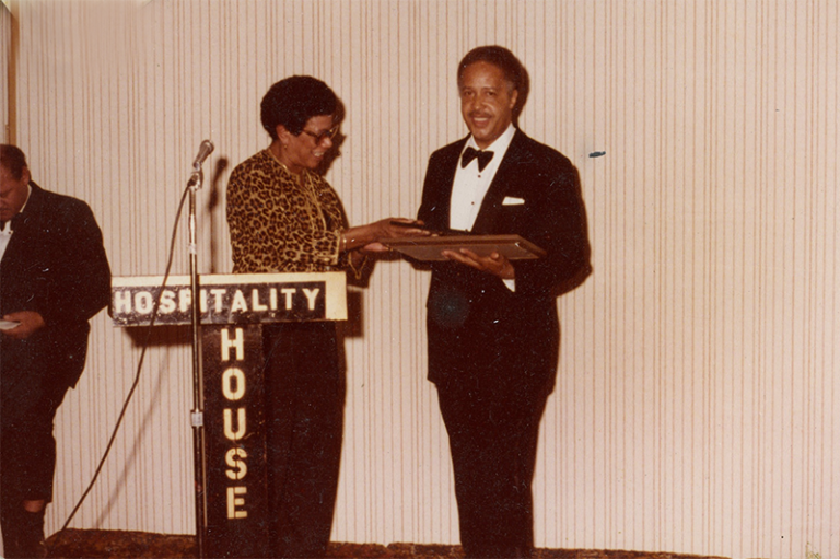 John Robinson receiving an award.
