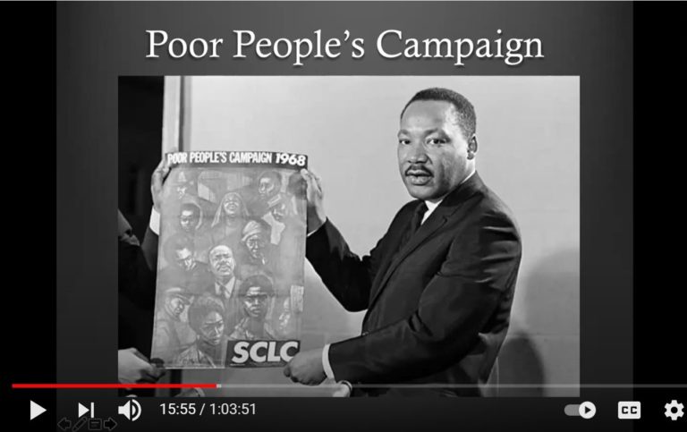 MLK holds banner under the words "Poor People's Campaign"