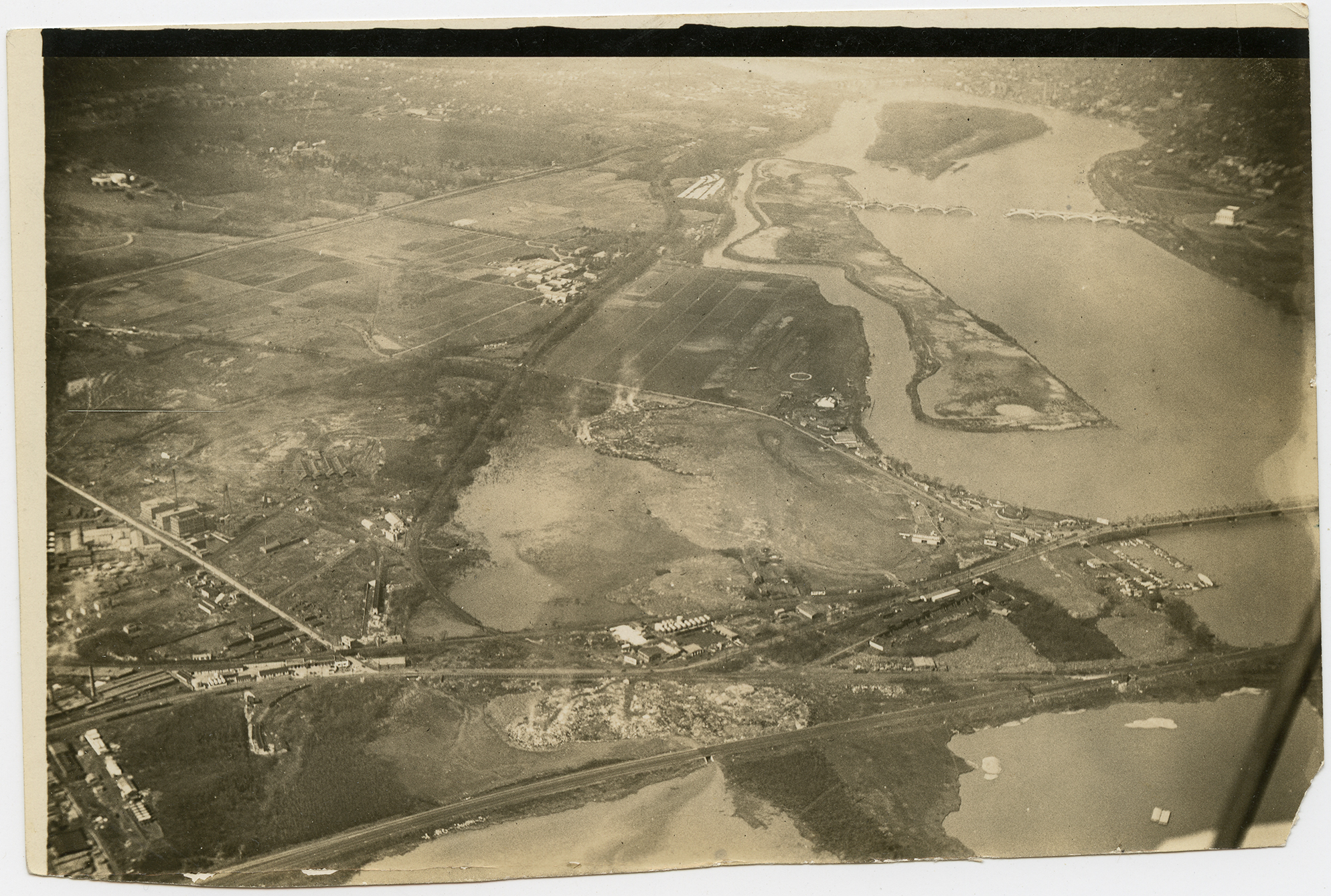 Aerial photograph of Washington Airport, Hoover Field, and the Arlington Beach and Amusement Park on the Potomac River. 1920, 1 print, b&amp;w, 4.25 x 6.5 in..