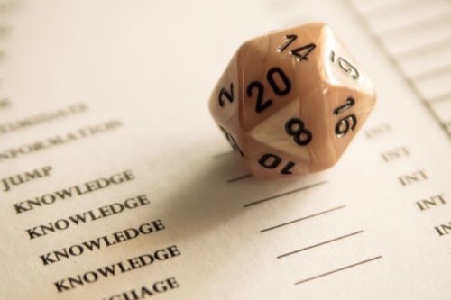 A 20-sided die on a Dungeons and Dragons character sheet