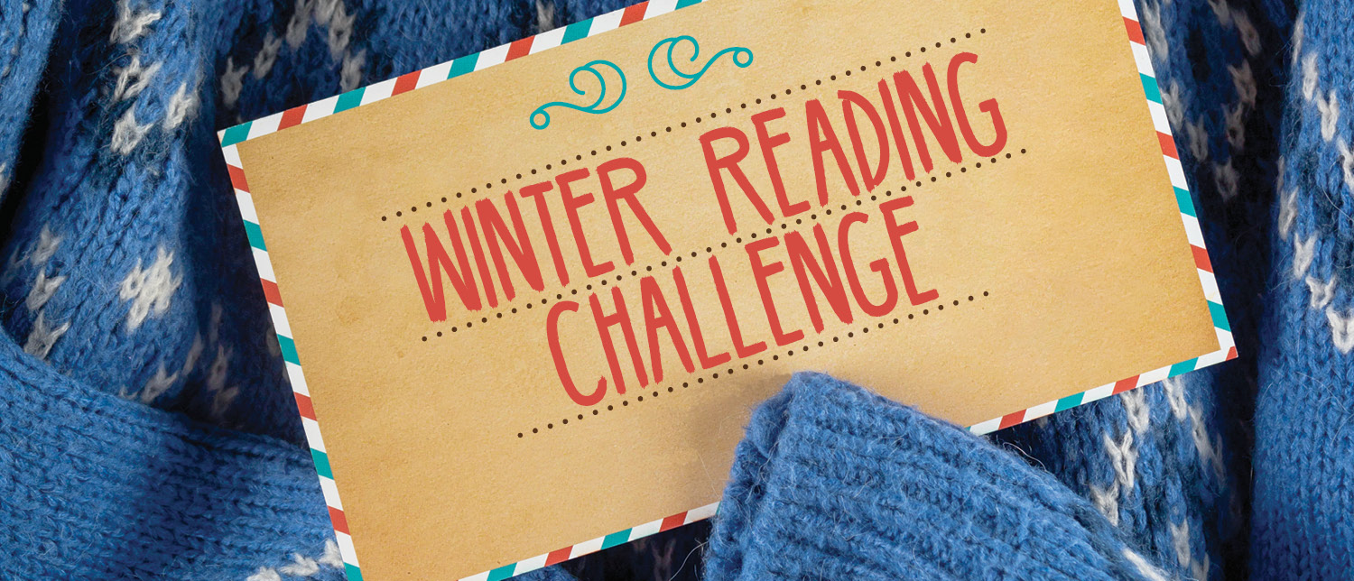 Blue sweater with postcard containing the text "Winter Reading Challenge."