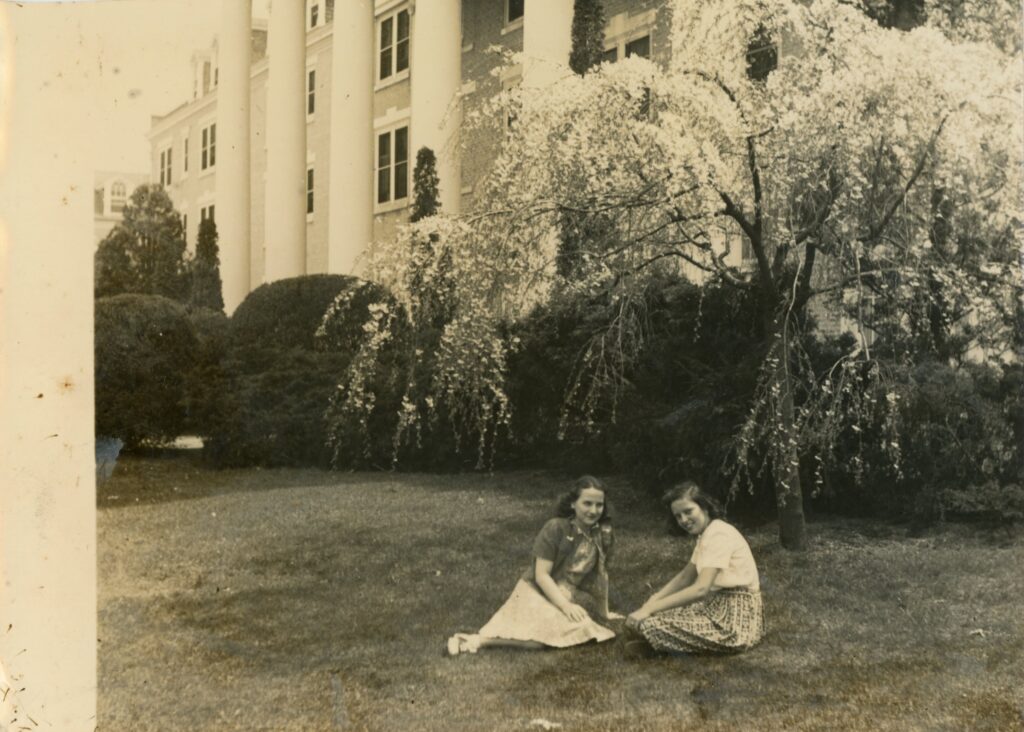 Paula Strother and her friend in front of Arlington Hall's historic main building.