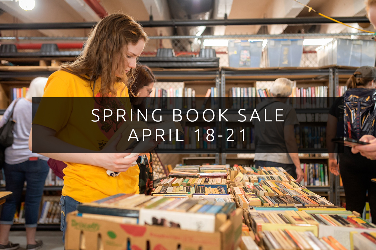 Spring Book Sale April 18-21 on a background of a person examining books in the Central Library garage.
