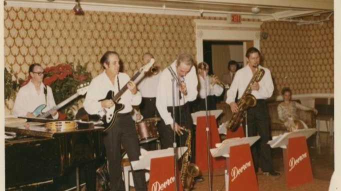 A band playing music at the Holly Ball.