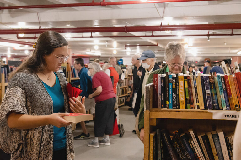 Patrons shopping the Friends of the Arlington Public Library book sale at the Central Library garage.