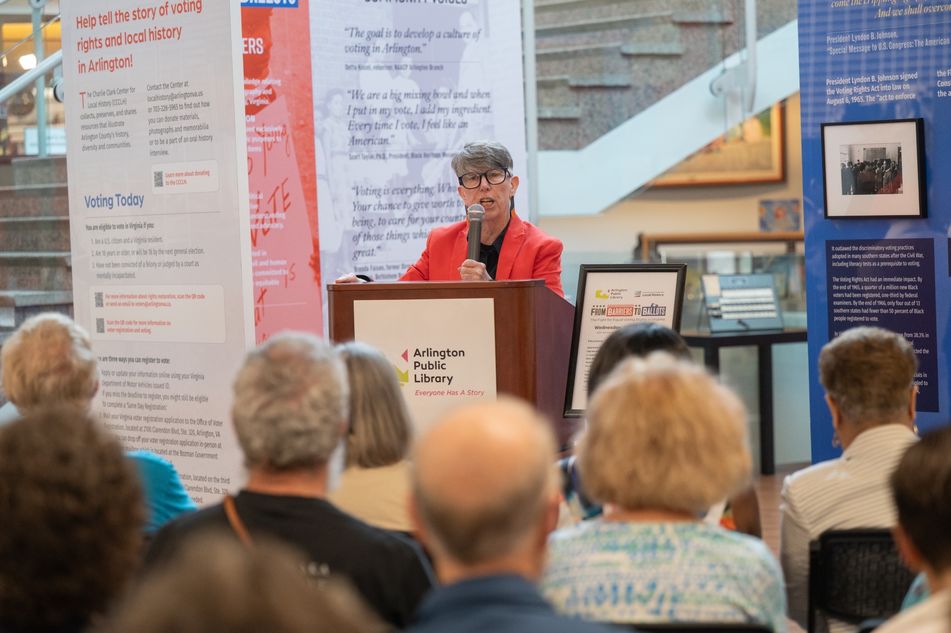 Library Director Diane Kresh addresses the crowd at the From Barriers to Ballots exhibition.