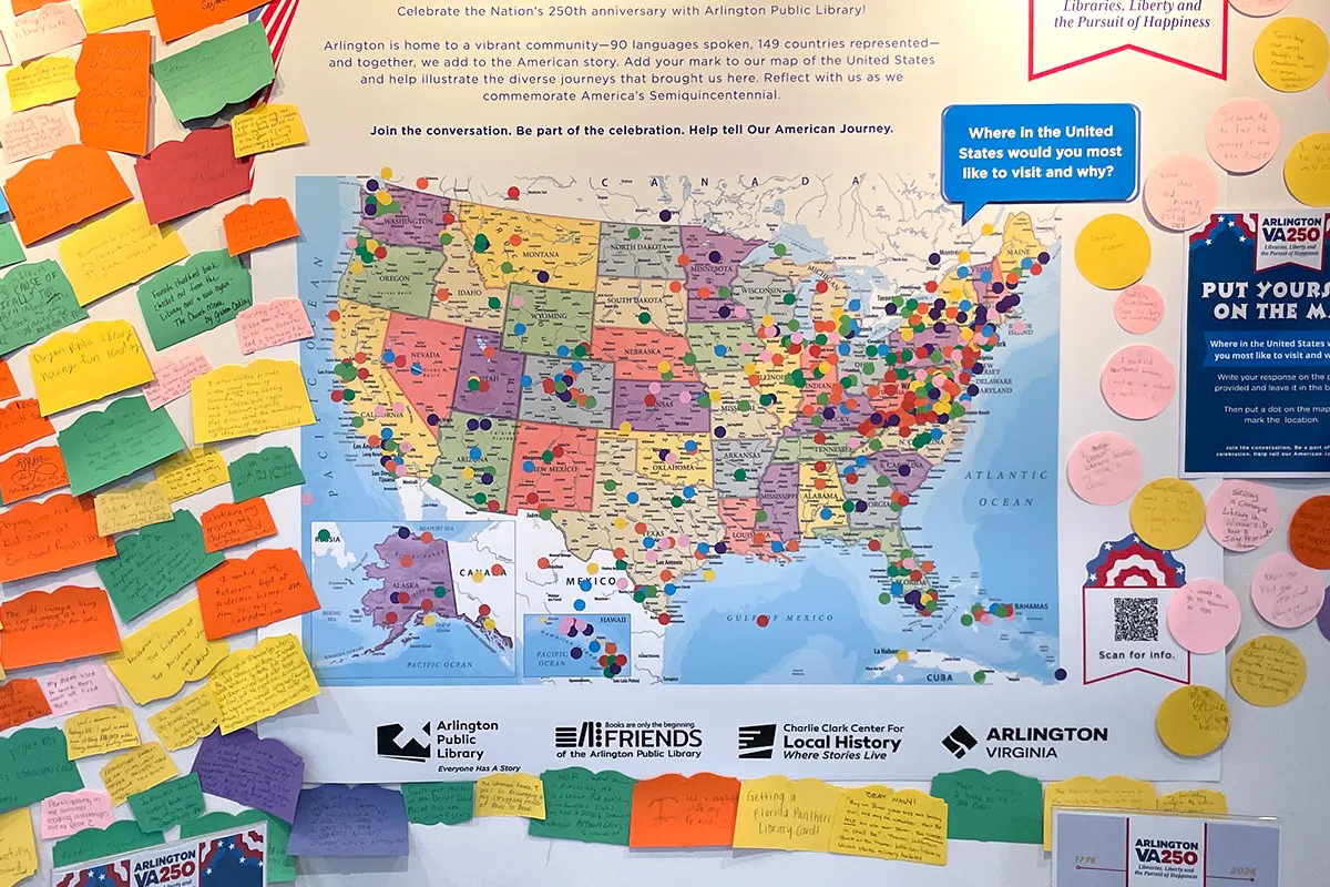 A poster of a United States map with stickers marking locations and memories at libraries across the country.