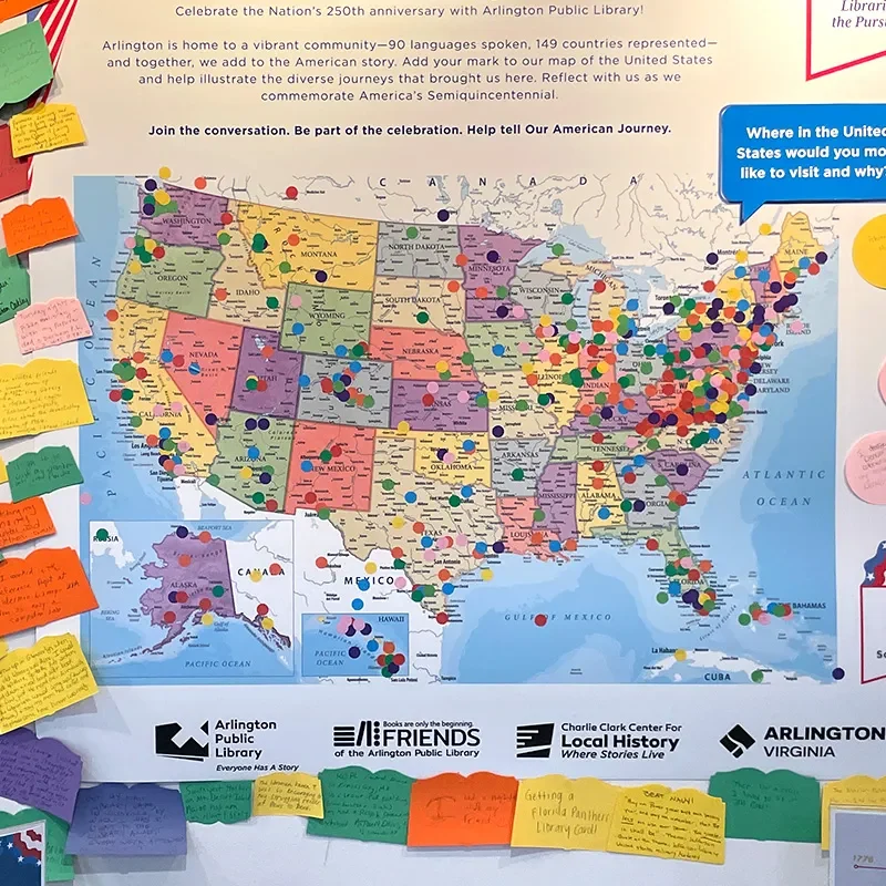 A poster of a United States map with stickers marking locations and memories at libraries across the country.