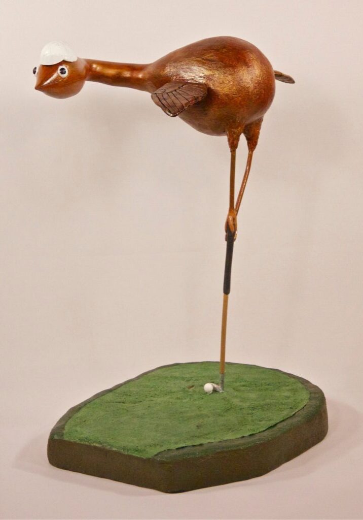 a bird with a golf putter.