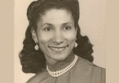 photo of Dorothy Ham, a beautiful black woman wearing pearl earings and a necklace, smiling at the camera
