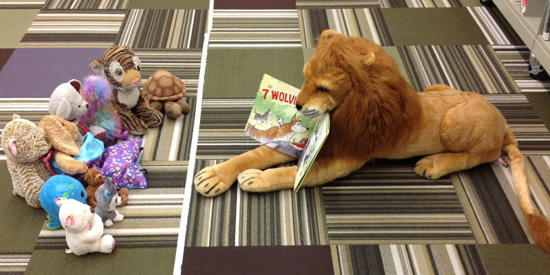 Lion reading to other animals.