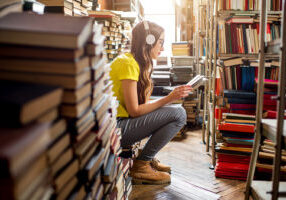 Young woman surrounded by books
