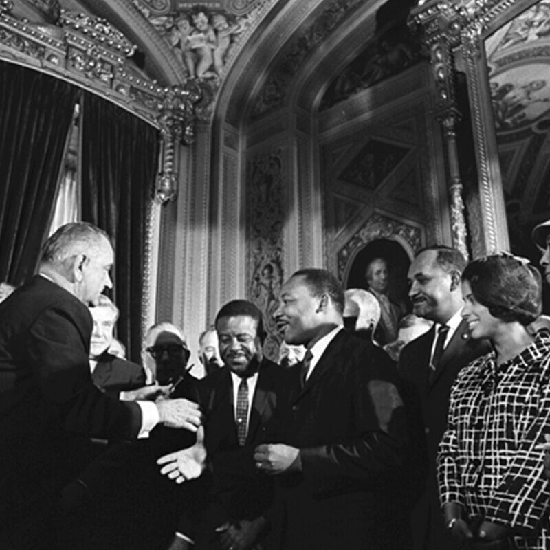 Photo of President Lyndon B. Johnson shaking hands with Martin Luther King, Jr., at the signing of the Voting Rights Act of 1965. Photograph by Yoichi Okamoto. Courtesy of the Lyndon B. Johnson Library.