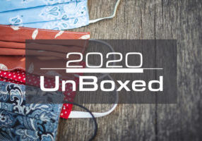 Photo of colored cloth face masks with a typographic logo of "2020 UnBoxed."